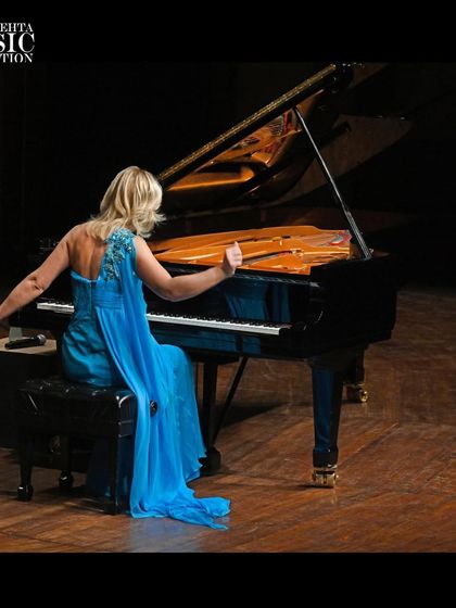 A powerful shot of pianist Olga Kern at the grand piano, showcasing her incredible command of the instrument during her recital at the NCPA.