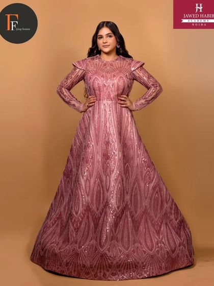 A full-length view of the ornate pink gown, showcasing our students' ability to create looks for high-end fashion.