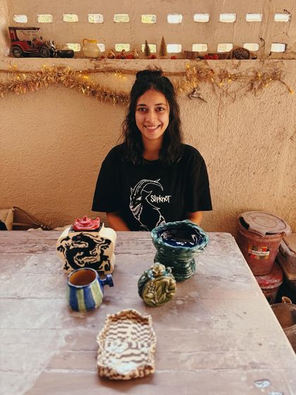 This student came in as a beginner, but her pieces look anything but. Her curious nature made her try things without overthinking, resulting in this bold and dramatic dragon jar and other wonderfully experimental pieces.