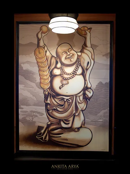 A custom Laughing Buddha artwork, designed in a monochrome, illustrative style to bring positive energy and a sense of fun to the restaurant's decor.
