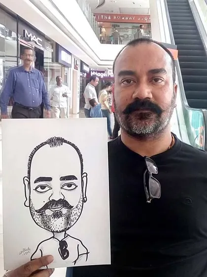 A classic black and white caricature drawn live at a mall. My setup is portable, allowing me to draw just about anywhere.