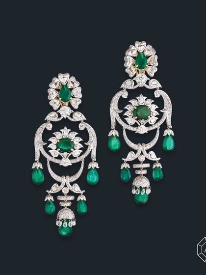 Crafted in 18kt gold, these earrings feature vibrant Zambian emeralds, sparkling round diamonds, elegant diamond briolettes, and rose-cut diamonds.