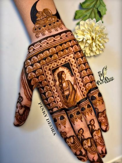 A Karwa Chauth design that tells a story. It features a woman waiting for the moon, with intricate borders and small elephant motifs on the fingers, blending tradition with detailed artistry.