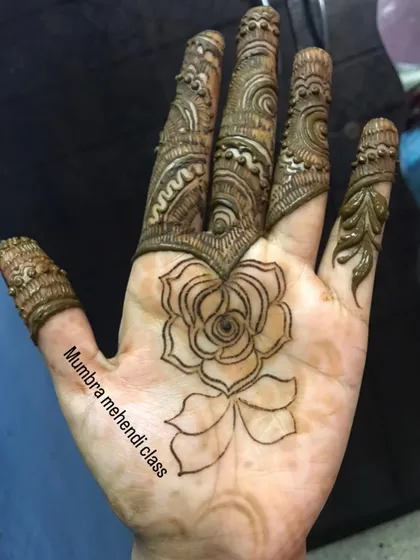 A close-up of the finger details that accompany the rose design.