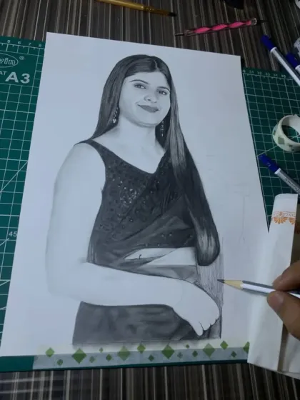 The portrait is nearly finished here, with just the final touches on the saree and arm remaining.