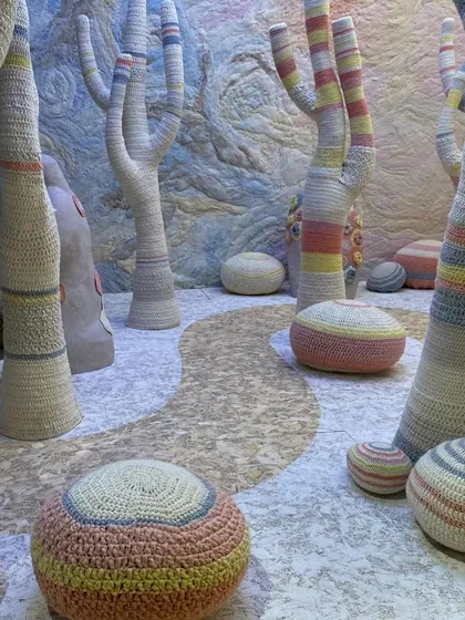 For the 'Hope You're Well' theme, we created a landscape that embodies empathy and wellbeing. Using hand-crocheted forms, we built a surreal desert of soft cacti and stones. The entire environment is a tactile exploration of texture and gentle color, inviting viewers into a space of comfort and acceptance.