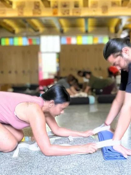 Our workshops are based on experience with real people. This image from our Elbows & Wrists workshop shows a partner-assisted stretch to create space in the wrist joint, a technique that will be available in our upcoming recorded sessions.