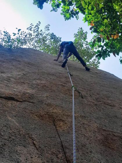A climber ascends a route in the early morning light. Our weekend sessions often start at dawn to make the most of the cool weather.