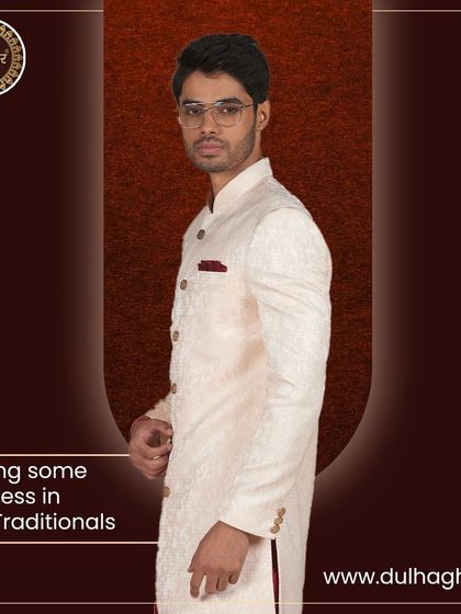 Having some richness in our traditionals. A side profile of the cream sherwani, highlighting its perfect fit and elegant fall.