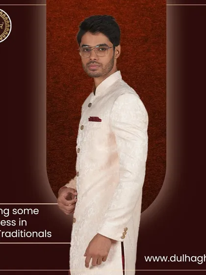 Having some richness in our traditionals. A side profile of the cream sherwani, highlighting its perfect fit and elegant fall.