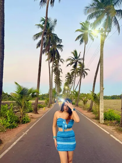 A beautiful shot on the famous Parra Road in Goa, surrounded by coconut trees. This is an iconic travel photo that I love to recreate.