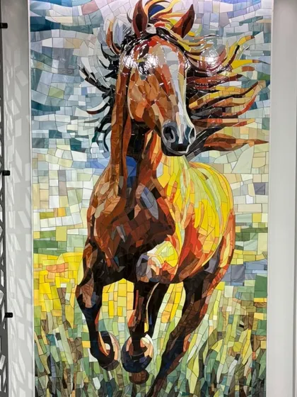 Artistry in every tile. This custom horse mural is made from thousands of individual mosaic pieces, handcrafted to create a dynamic and powerful centerpiece. We can create any design, turning your vision into a timeless mosaic artwork.