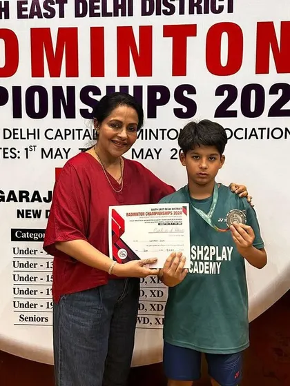 A young champion from my academy receiving his medal at the South East Delhi District Badminton Championship. It's a proud moment for me to see my students' hard work recognized.