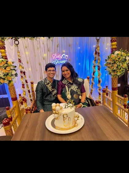 We are so happy to be part of our clients' journey from pregnancy announcement to baby shower. Here is the happy couple with their elegant white and gold "Oh Baby" cake.