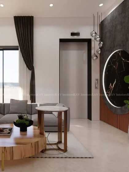 A beautifully lit living area in a villa, showcasing a custom-designed wall partition next to the elevator. The space features a comfortable L-shaped sofa and a modern coffee table, perfect for family gatherings.