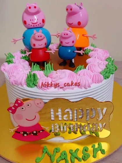Bringing smiles to little ones' faces is the best part of my job. This Peppa Pig themed cake is decorated with whipped cream frosting and features the entire Peppa family as playful toppers, perfect for a toddler's birthday.