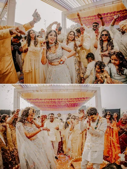 Rahul and Riya's Carnival Haldi was an explosion of joy. This shot captures the couple and their guests dancing under a shower of flower petals, a perfect representation of the high-energy celebration.