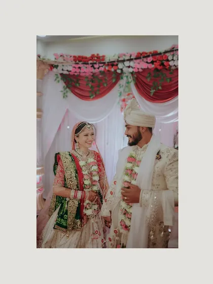 A classic portrait of the bride and groom after the ceremony. Their happy smiles and intertwined hands tell the story of their new beginning.