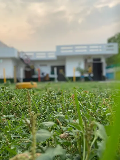 A low-angle view of our big, spacious playground before the grass was fully grown. I'm dedicated to creating the best possible play area.