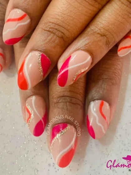 A beautiful abstract design with a nude base and flowing, wavy stripes of orange, pink, and white, with a touch of gold glitter.
