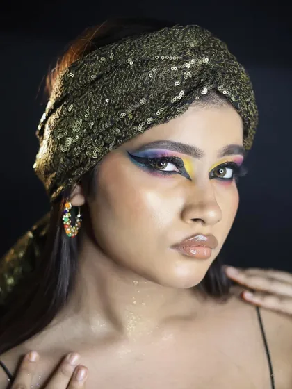 A confident portrait of the Egyptian look, showing the full face of makeup.