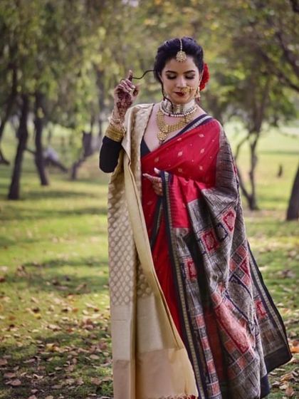 A modern bride who wants to blend tradition with her personal style. This reception look incorporates a vintage feel with a modern twist, perfect for an outdoor setting.