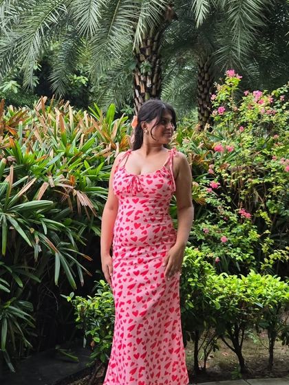 A candid, happy photo in the heart-print dress. My styling philosophy is all about finding clothes that not only look good but also make you feel great.