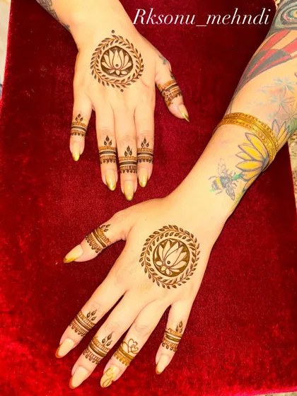 Sometimes, less is more. This minimalist design features a clean, elegant lotus mandala on the back of the hands, proving that a single, well-placed motif can be just as stunning as a full-coverage piece.