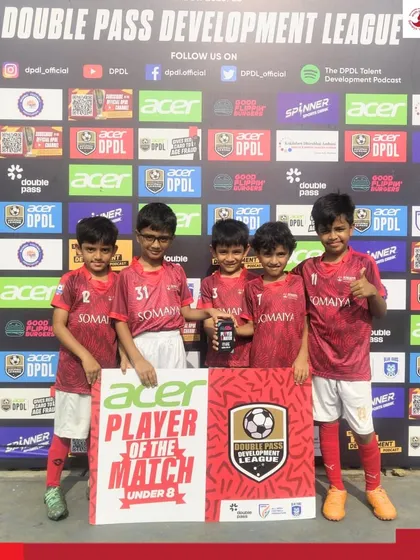 The full U-8 team celebrates their win and Madhav Verma's individual award, highlighting great teamwork.