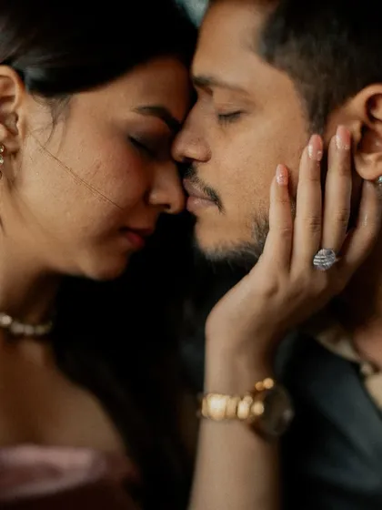 A quiet, intimate close-up from a pre-wedding shoot. This photo is all about the feeling of closeness and the peaceful connection between two people.