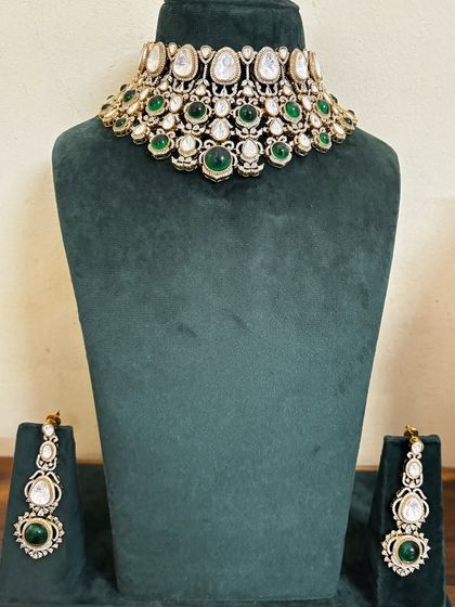This elegant Kundan necklace and earring set features green stones. It's a lighter option for pre-wedding functions or for a minimalist bridal look.