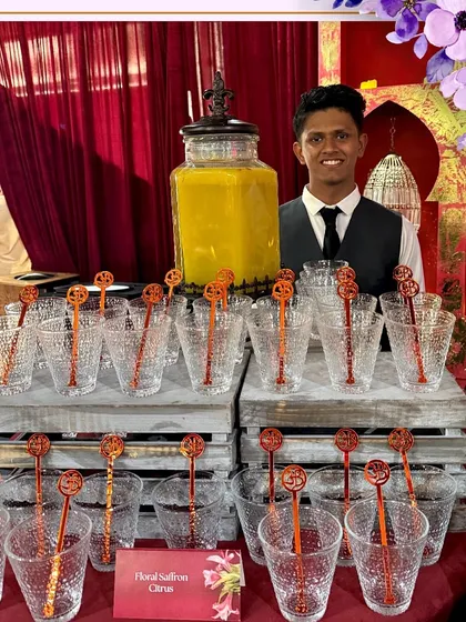 A bartender at our Floral Saffron Citrus mocktail station at the Leela Delhi wedding.