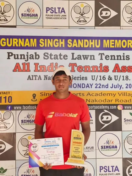NTC's Rudra Batham with his trophy and certificate after winning the doubles title at the Jalandhar NS-16.