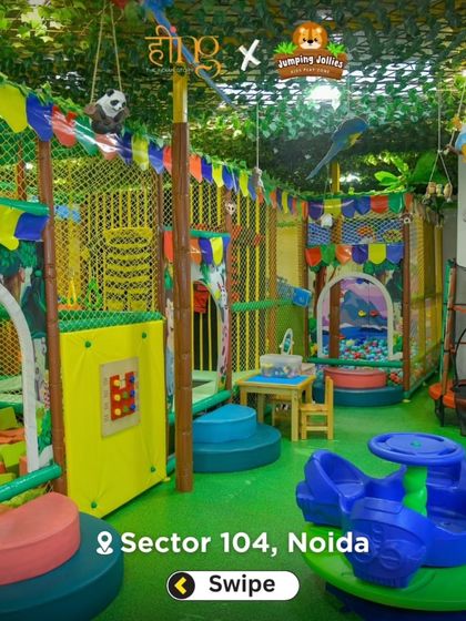 Another wide shot showing the different zones of our playground, including the foam pit, trampoline, and merry-go-round, all decorated with a fun jungle theme.
