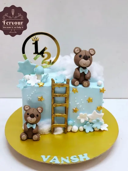 A half birthday cake with a "Twinkle Twinkle Little Star" theme. This cake features cute teddy bears, a ladder to the clouds, and golden stars.