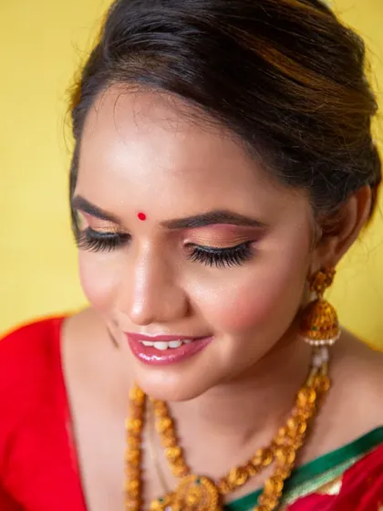 A close-up showing the flawless eye makeup and long lashes that make her eyes stand out.