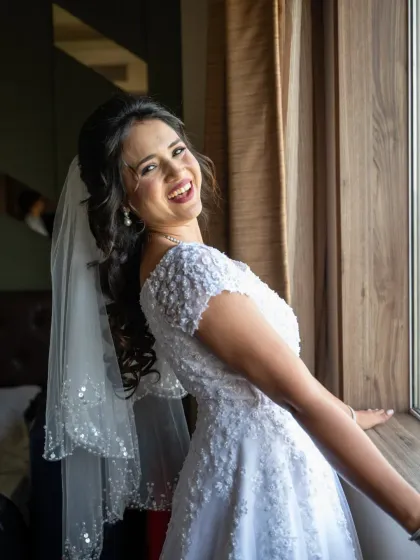 A bride's joyful, infectious smile. My goal is to make you feel comfortable and have fun, so we can capture genuine moments like this.