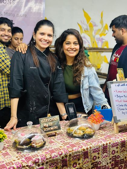 A happy moment from my food exhibition stall. It was amazing to meet customers in person and share my passion for baking. We even won an award for our Korean Garlic Buns.