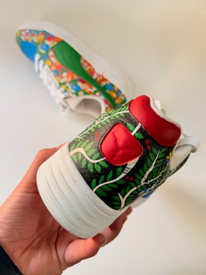 The heel view of the custom Pumas, showing how the artwork wraps around the entire shoe. Even the smallest sections are filled with detail to create a complete, immersive piece of art.
