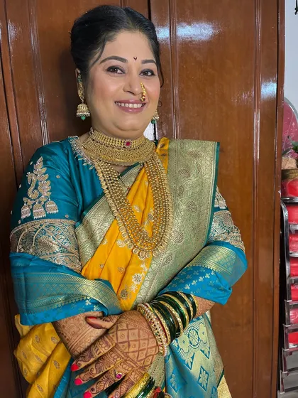 The complete look, with the bride looking confident and beautiful. I ensure every element, from makeup to draping, is perfect.