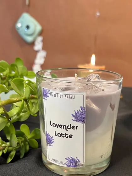 A close-up of the calming Lavender Latte candle. The beautiful purple hue and soothing scent make it a perfect candle for relaxation.