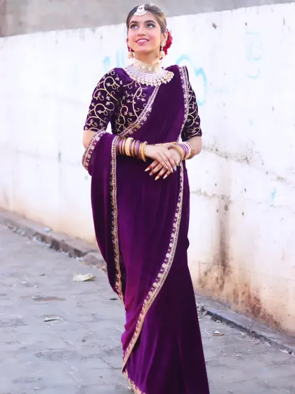 A full-length view of the stunning velvet saree, perfect for a grand reception.
