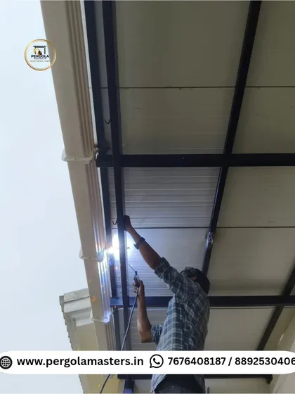 An image of our technician welding the metal frame for a puff sheet pergola. This shows the strong and precise construction that forms the foundation of our durable and insulated roofing solutions.