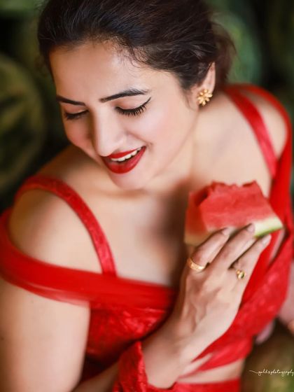 A creative and vibrant summer-themed shoot with an actress in a red outfit surrounded by watermelons. This series is playful and colorful, perfect for a brand campaign or a unique portfolio piece.