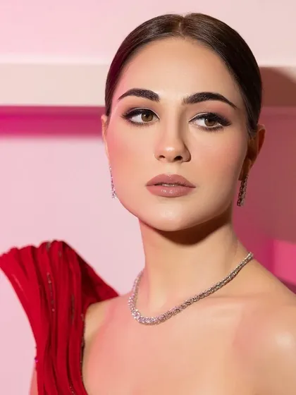 A classic beauty shot. The styling is clean and sophisticated, allowing the model's natural beauty to shine.