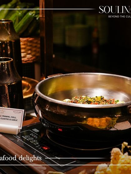 A live station featuring seafood delights like Prawns Chilli Garlic. We offer a range of premium options to elevate any corporate menu.