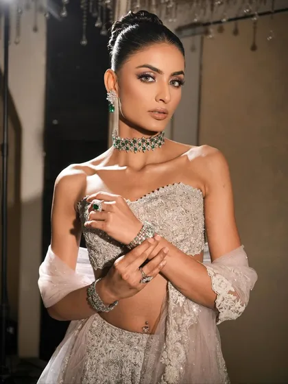 Another angle showcasing the intricate details of the outfit and the flawless makeup. This look is a statement in every sense of the word.