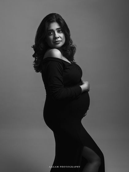 A classic three-quarter portrait, her direct gaze creating a strong connection with the viewer.