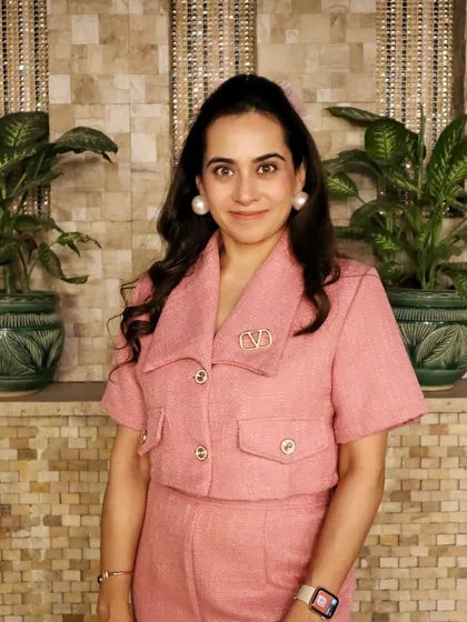 The details make the outfit. This close-up highlights the texture of the fabric and the polished hardware on the jacket. I guide my clients on choosing pieces with quality details that elevate their overall look and contribute to a powerful personal brand.