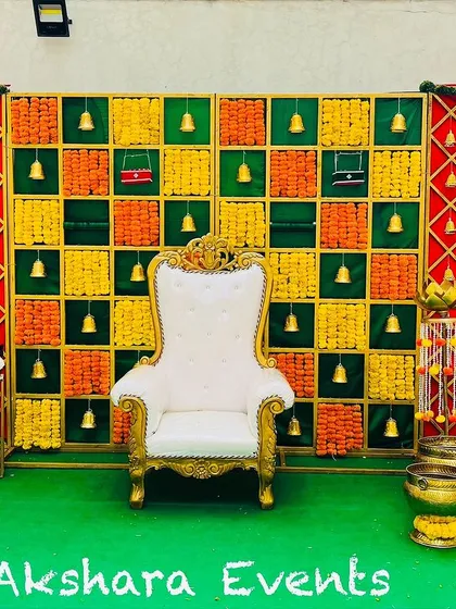 I offer a variety of backdrop styles to suit your taste. This popular checkered panel design, made with woven fabrics and accented with traditional brass bells, adds a unique texture and rhythm to the stage for a baby shower or naming ceremony.